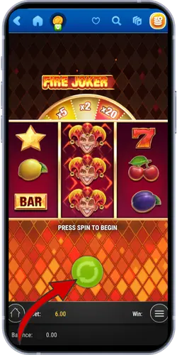 Fire Joker slot mobile gameplay with spin button highlighted